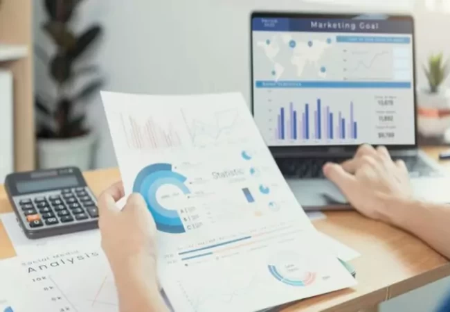 "Image description: A computer monitor displaying financial data charts."